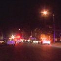 One murder suspect in custody, one at large